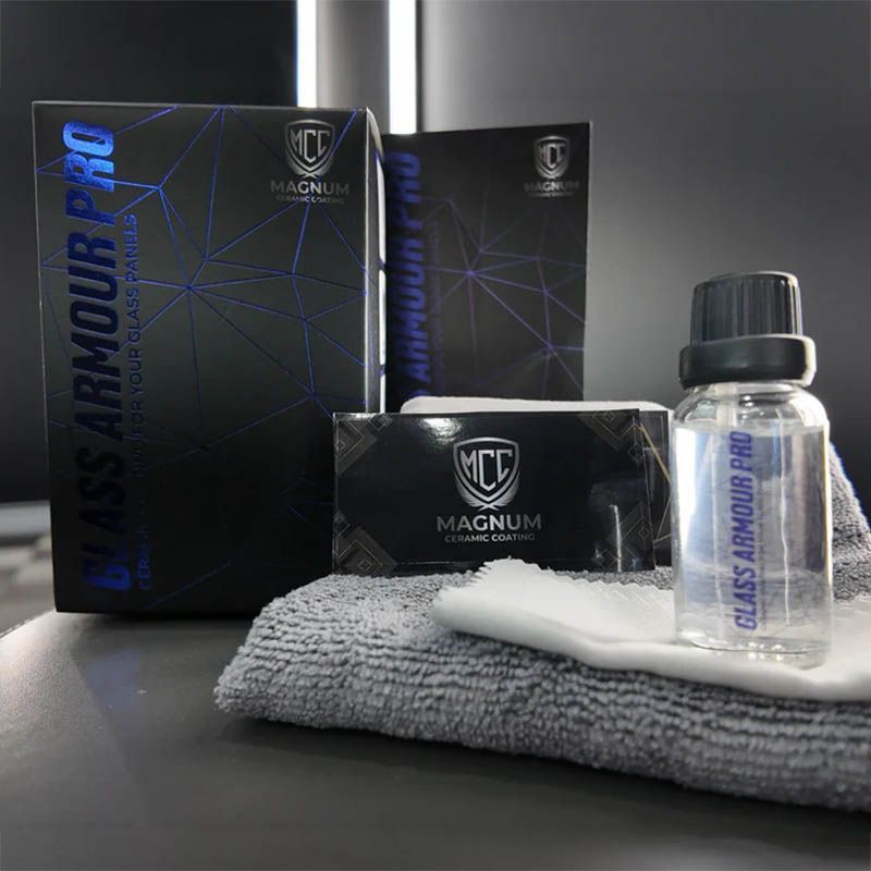 Magnum Car Wash Armour product boxes and bottle on folded towels in a studio setting