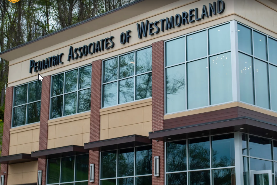 A Pediatric Associates of Westmoreland building with lots of windows.