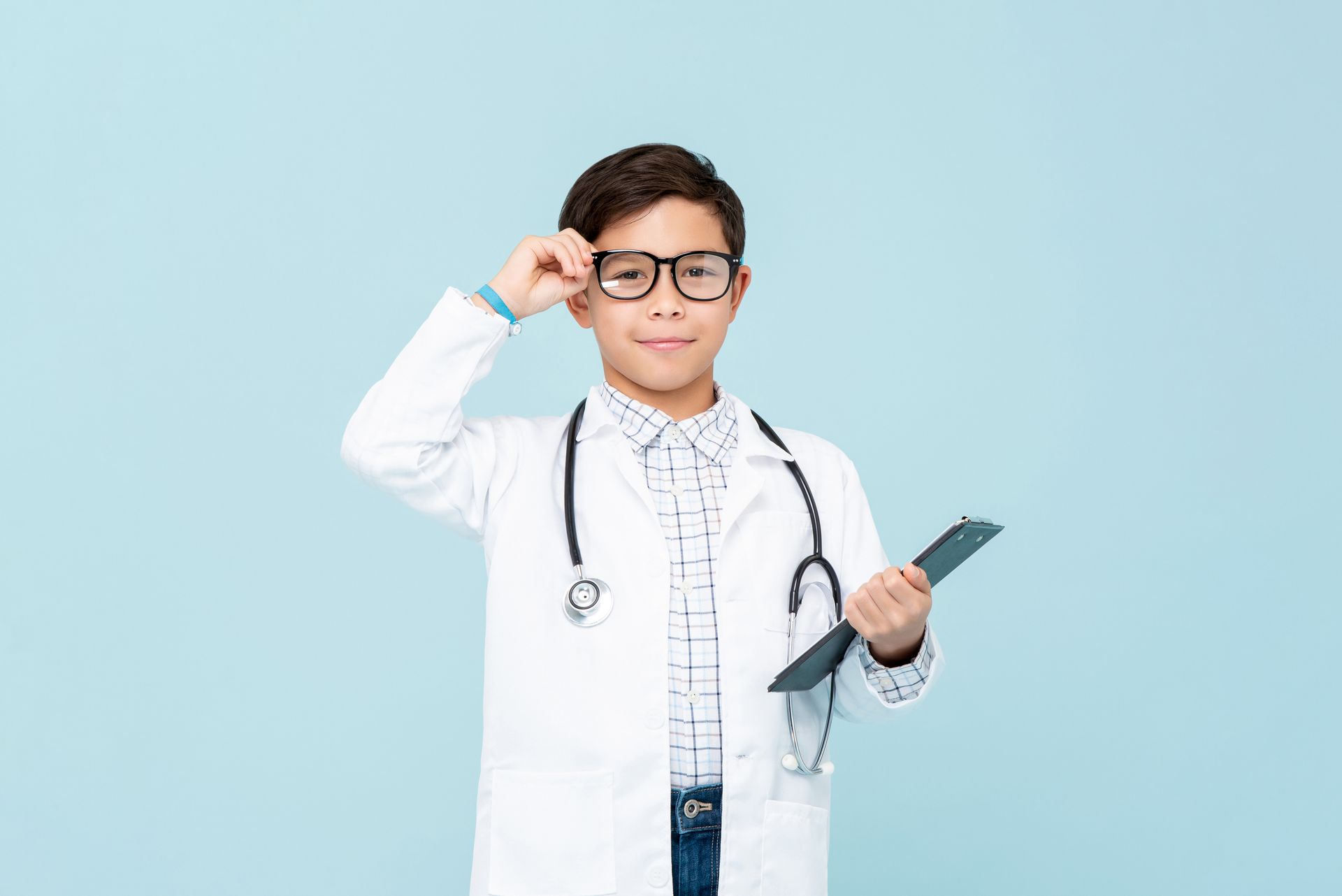 A young boy dressed up as a doctor.