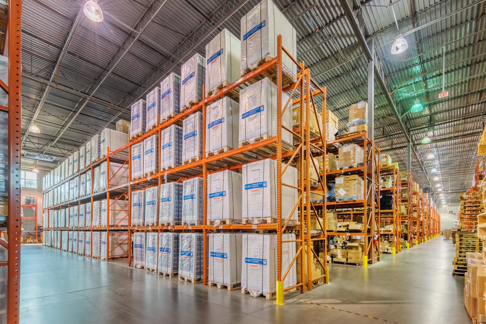 A large warehouse filled with lots of shelves and boxes.