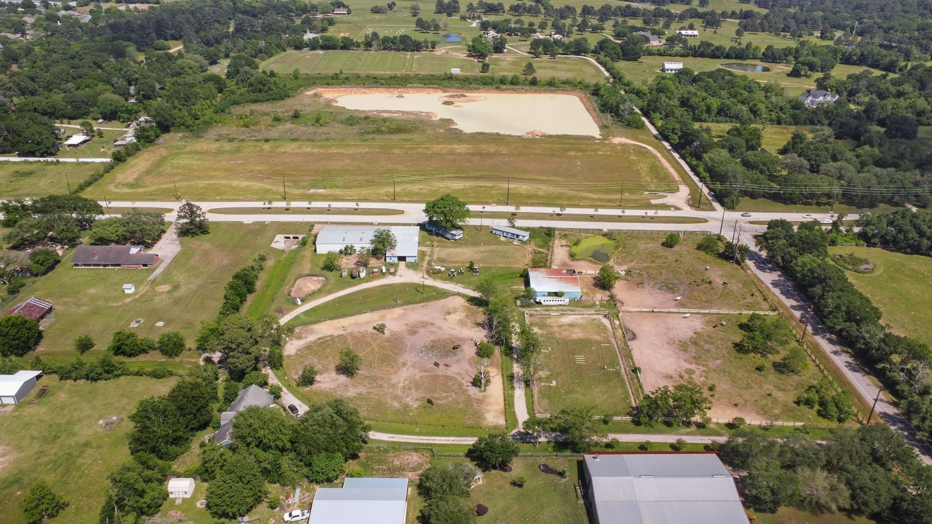 An aerial view of a residential area with lots of trees and buildings.