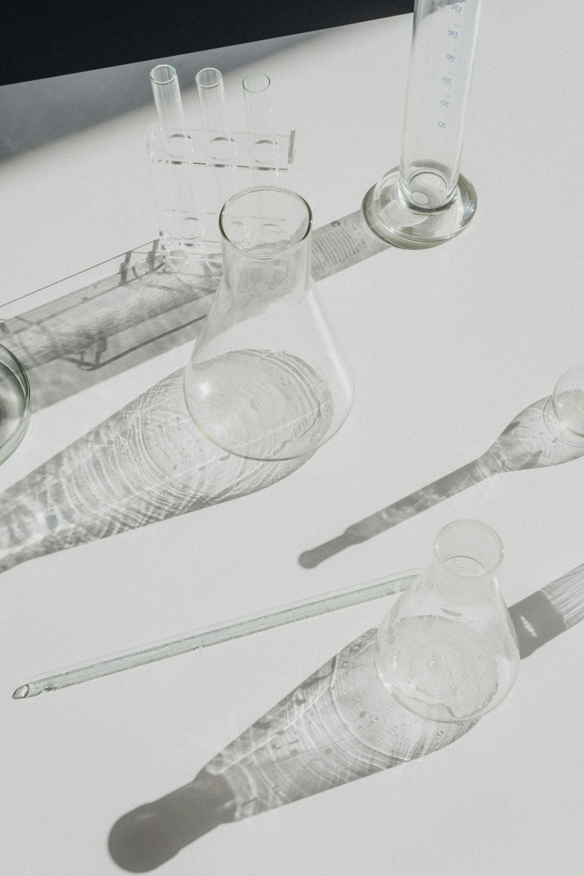 Image of glass laboratory beakers on a white table
