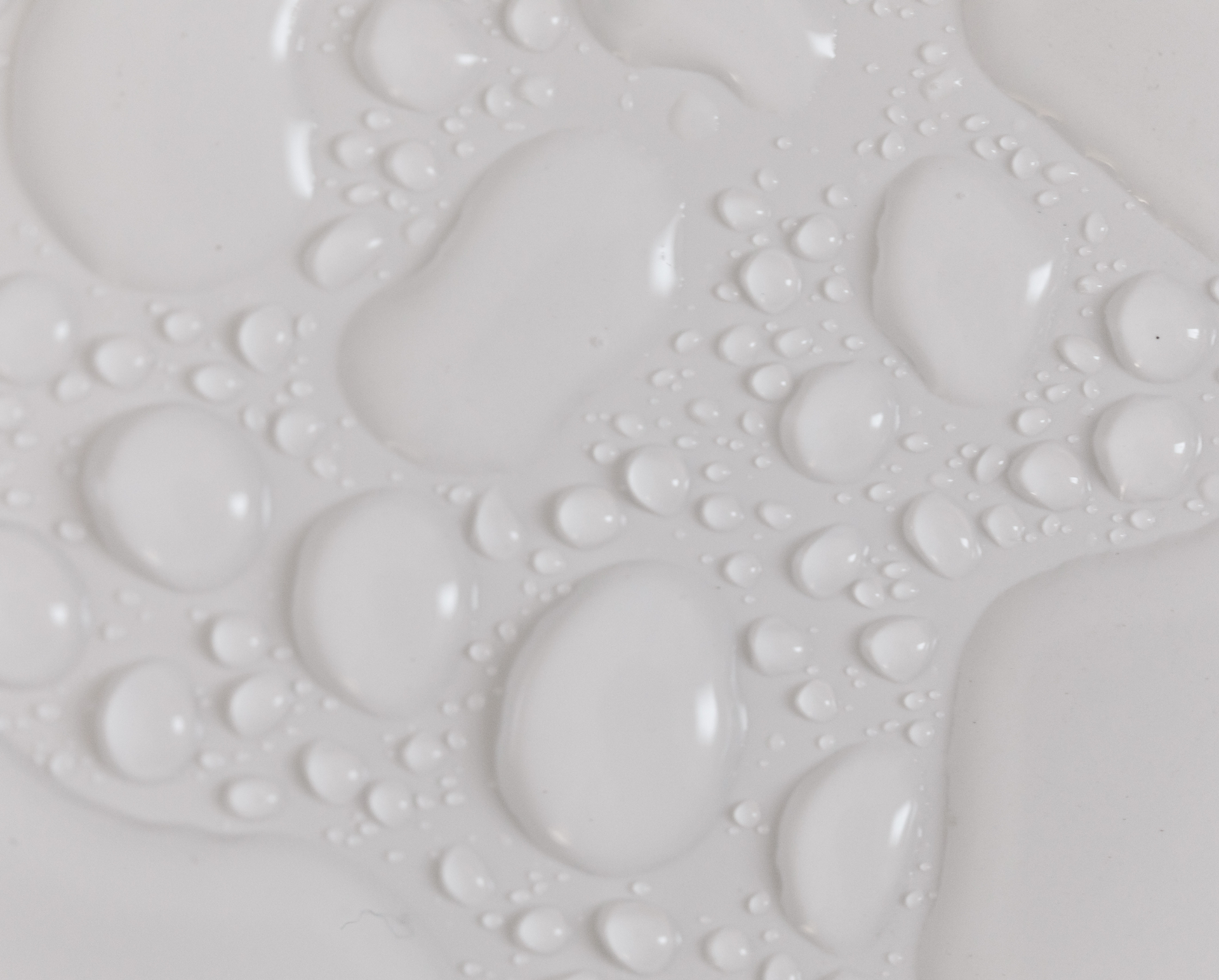 Image of clear  liquid droplets close up