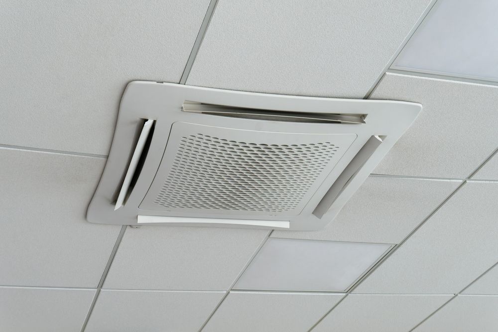 Ceiling-mounted Air Conditioning Unit Set in White Tile Ceiling — Priest Airconditioning in Ashmont, NSW