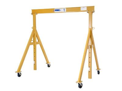 A yellow crane with wheels on a white background.
