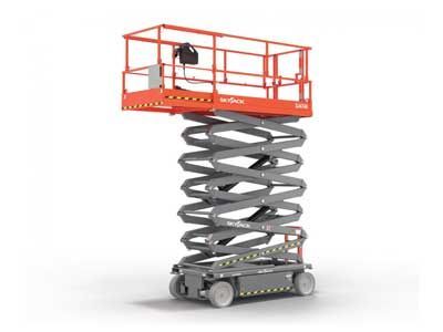 A scissor lift is sitting on top of a white surface.