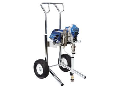 A spray paint machine is sitting on a cart on a white background.