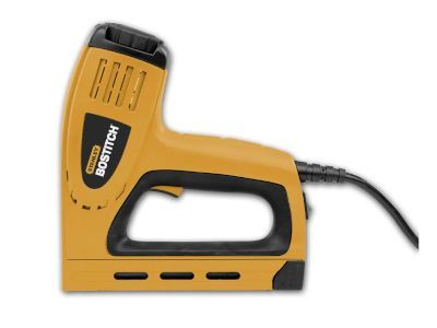 A bostitch stapler is sitting on a white surface.