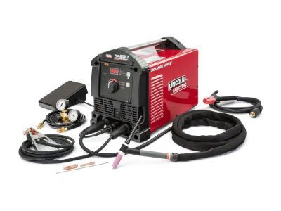 A red welding machine with a hose attached to it on a white background.