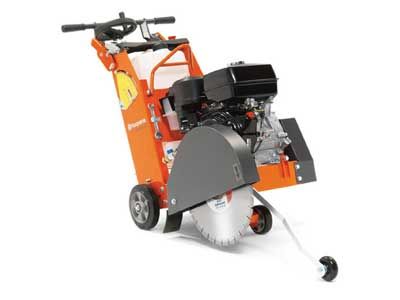 A concrete saw is sitting on a white surface.