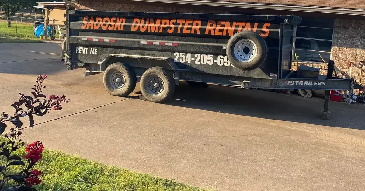 Sadoski Dumpster Rentals roll-off dumpster on site during roofing project Hill County TX