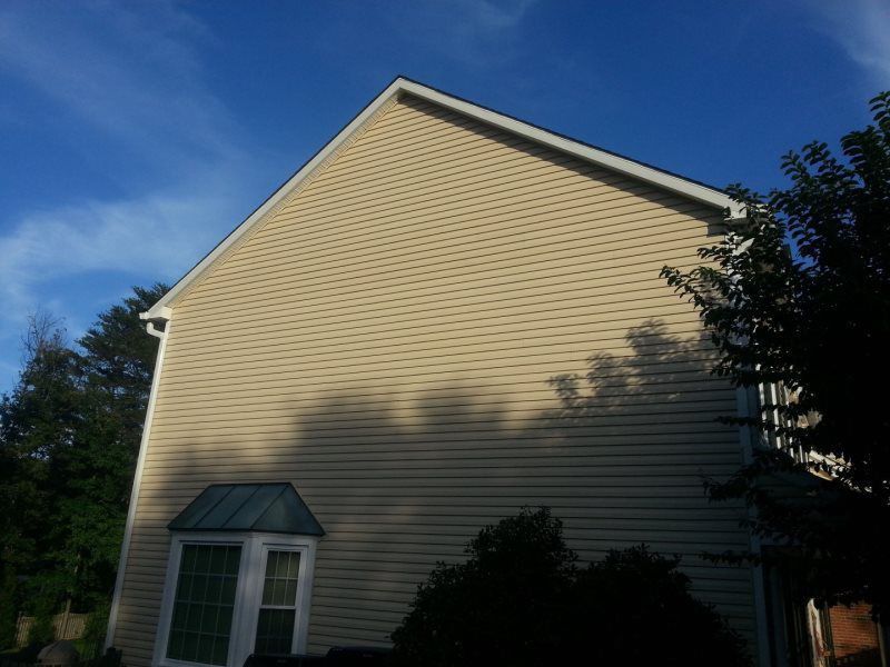 a large house with a blue sky in the background