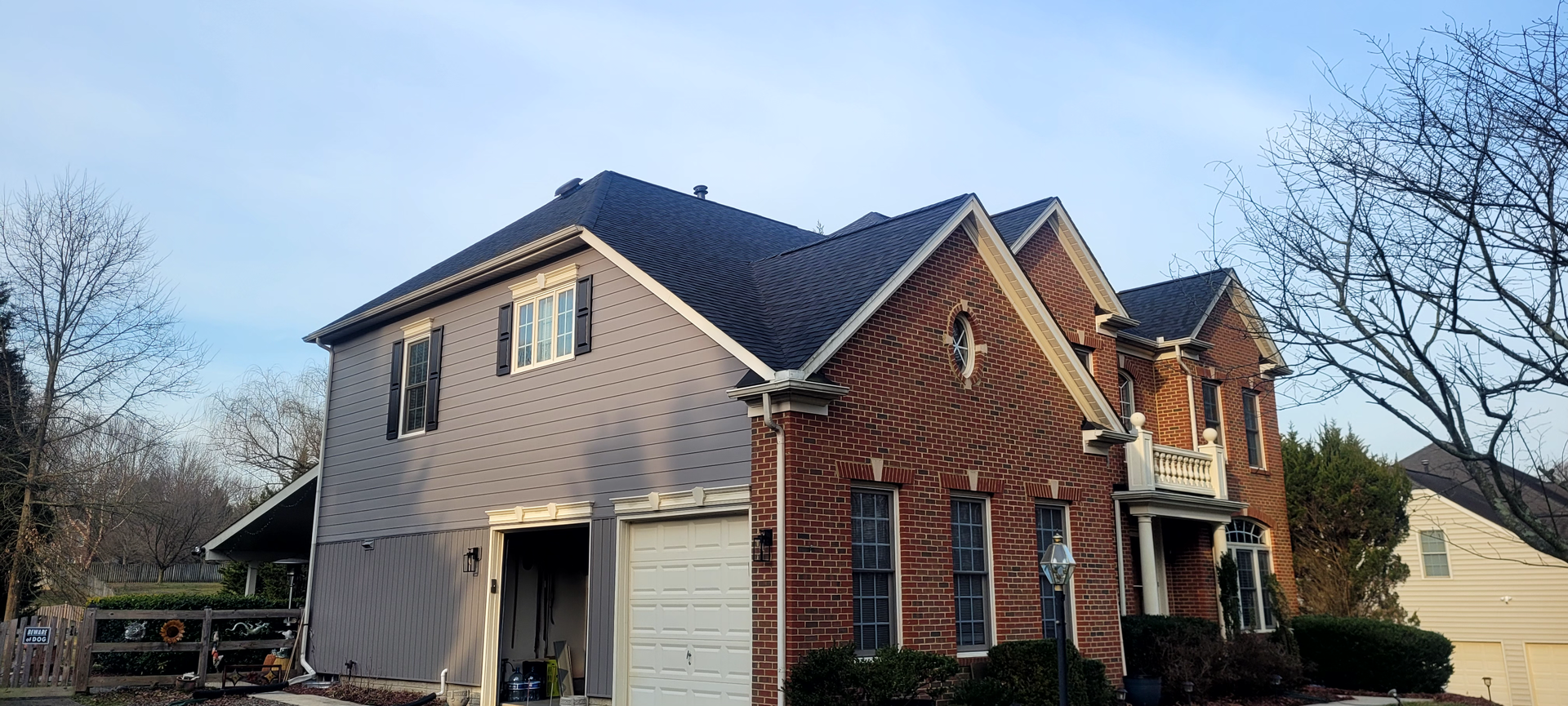 a large house with green shutters and a sign that says premier