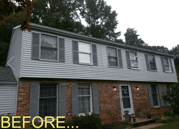 a before picture of a brick house with shutters