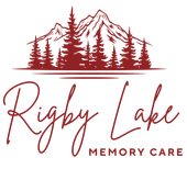 Logo for Rigby Lake Memory Care: Maroon mountain, pine trees, and cursive
