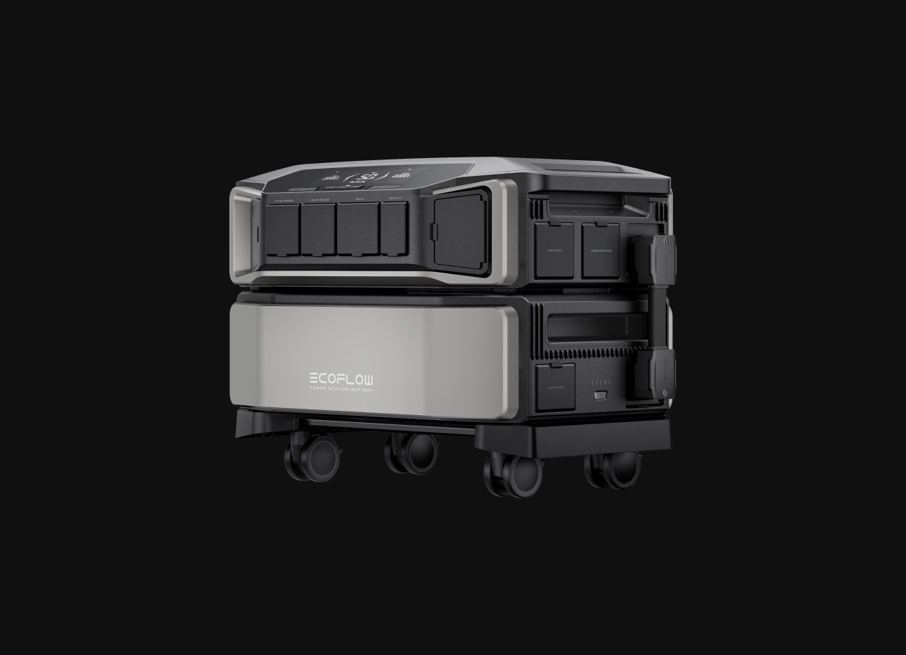 A silver and black portable power station on wheels, against a black background.