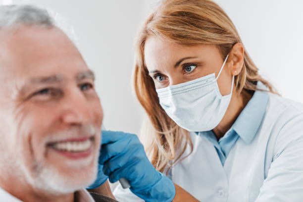 a doctor doing a Micro-ear Cleaning
