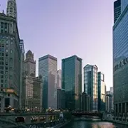 Chicago skyline with skyscrapers reflecting in the river at dusk