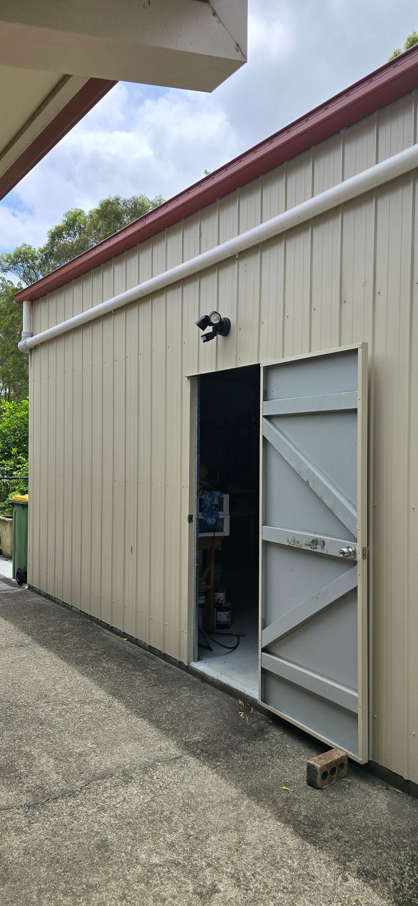 Shed Door With a Light Above — D.J. Whatley & Son Pty Ltd in Ormeau Hills, QLD