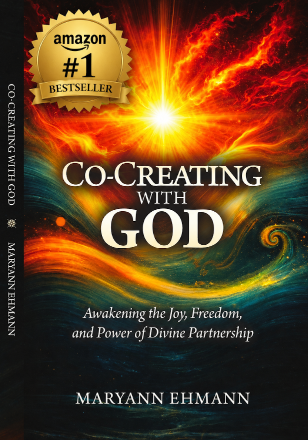 Book cover with fiery orange artwork and title “Co-Creating with God” by MaryAnn Ehmann