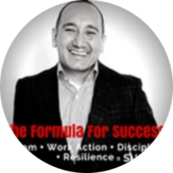 Smiling man in a suit with red text reading “the formula for success” overlaid at the bottom