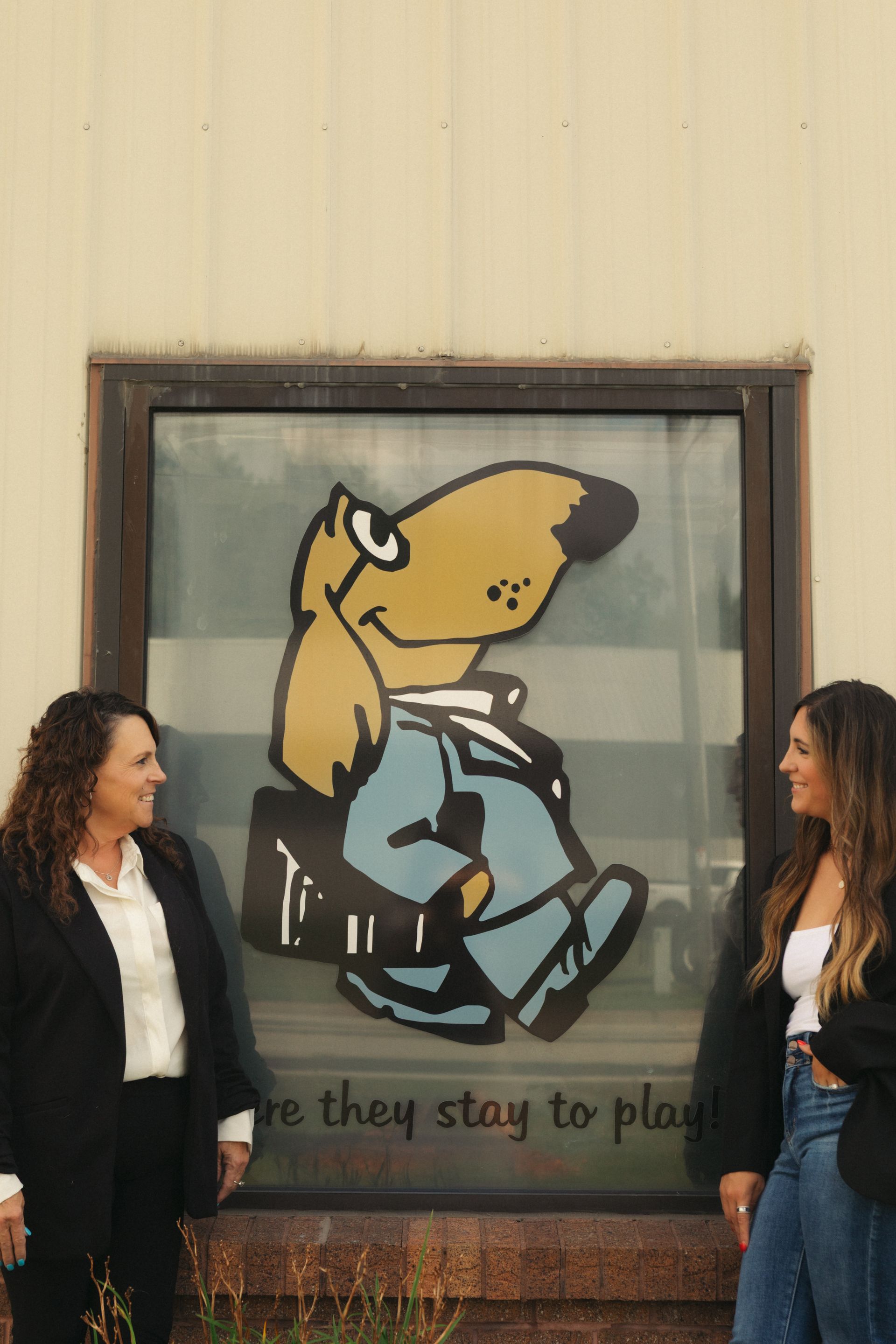 Dog grooming business owner caring for a happy dog