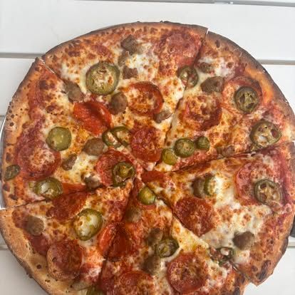 Saint Joe's Pizza in historic downtown Gainesville, Texas near River of Love Cabins serving Chicago-style deep dish, New York-style pizza, pasta, and Italian favorites.