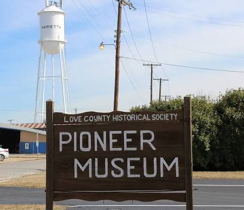 Love County Historical Society Pioneer Museum in Marietta, Oklahoma near River of Love Cabins featuring pioneer artifacts, historic photographs, local history exhibits, and early Oklahoma heritage.