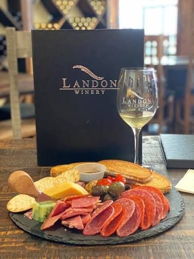 Landon Winery tasting room in downtown Gainesville, Texas near River of Love Cabins offering award-winning Texas wines, wine tastings, charcuterie boards, and a romantic date night experience.