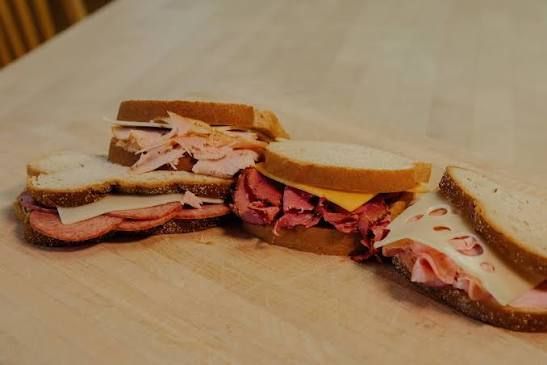 Robertson's Hams smokehouse and deli in Marietta, Oklahoma near River of Love Cabins serving hickory-smoked ham, beef jerky, sandwiches, and Oklahoma-made specialty meats.