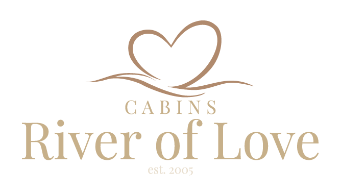 Cabins River of Love logo with a beige heart and wave above the name on a white background