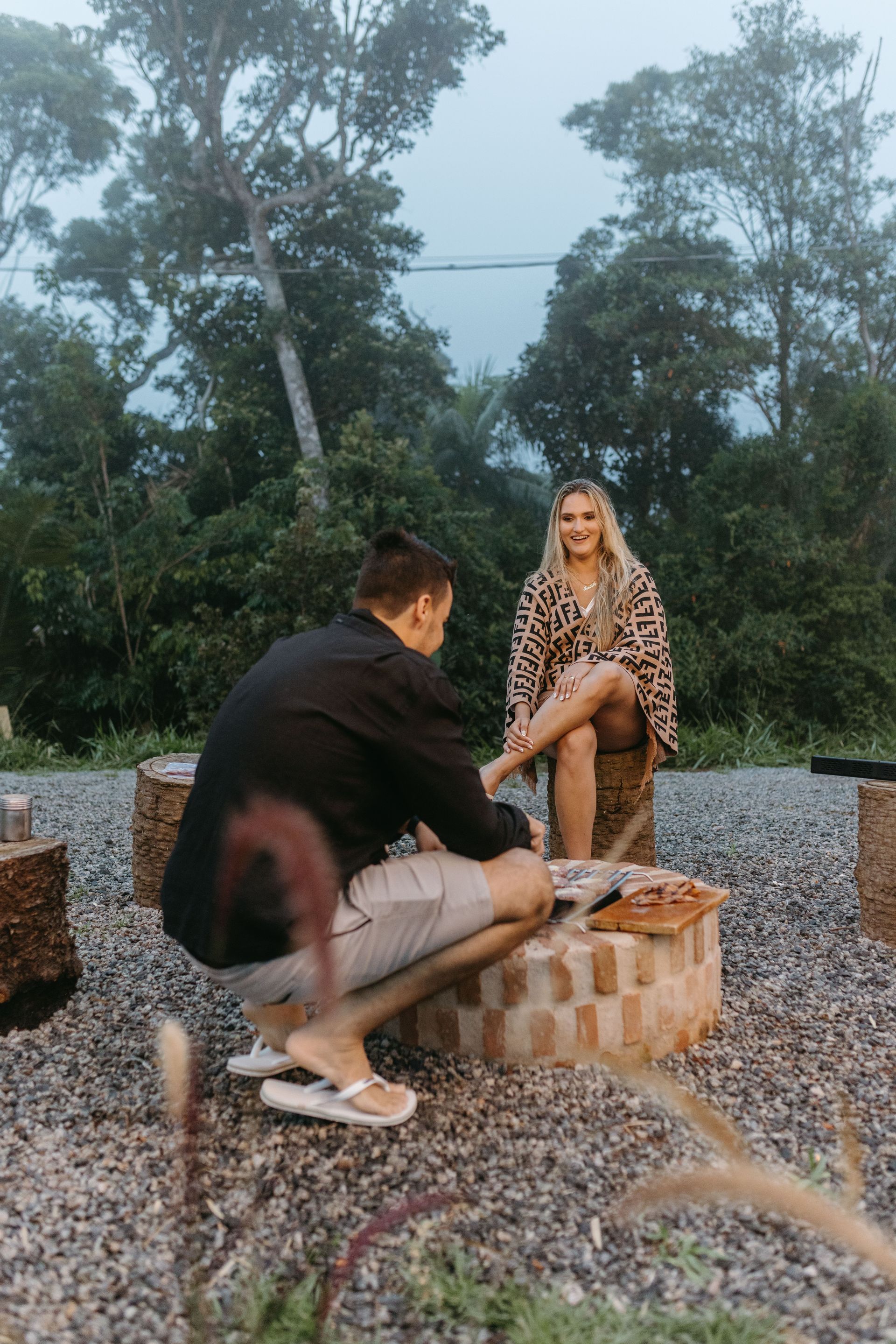 Couple enjoying a fall break weekend at a private River of Love cabin fire pit