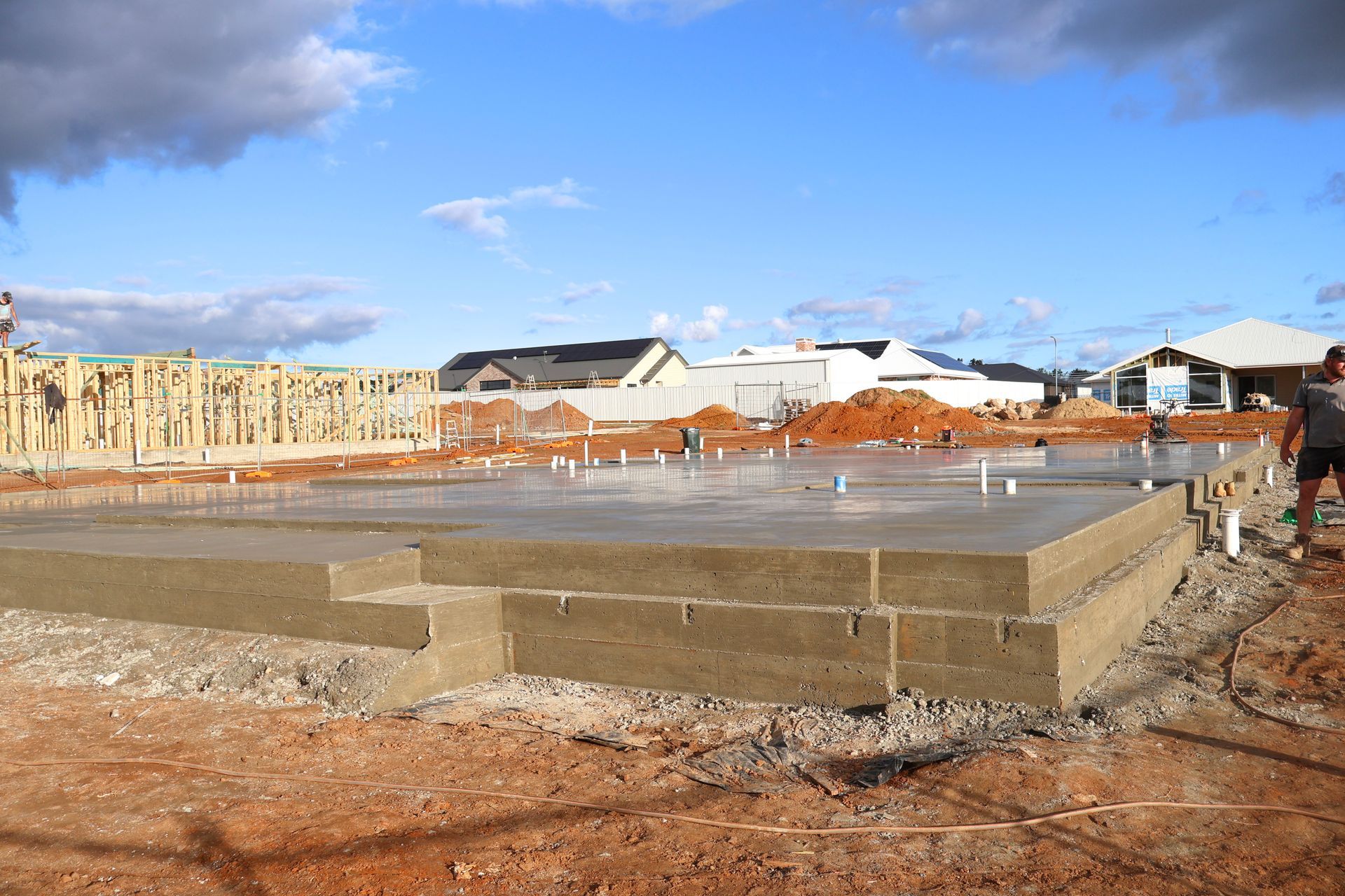 Foundation slab at a residential construction site under a blue sky — Complete Concreting Riverina In Ashmont, NSW