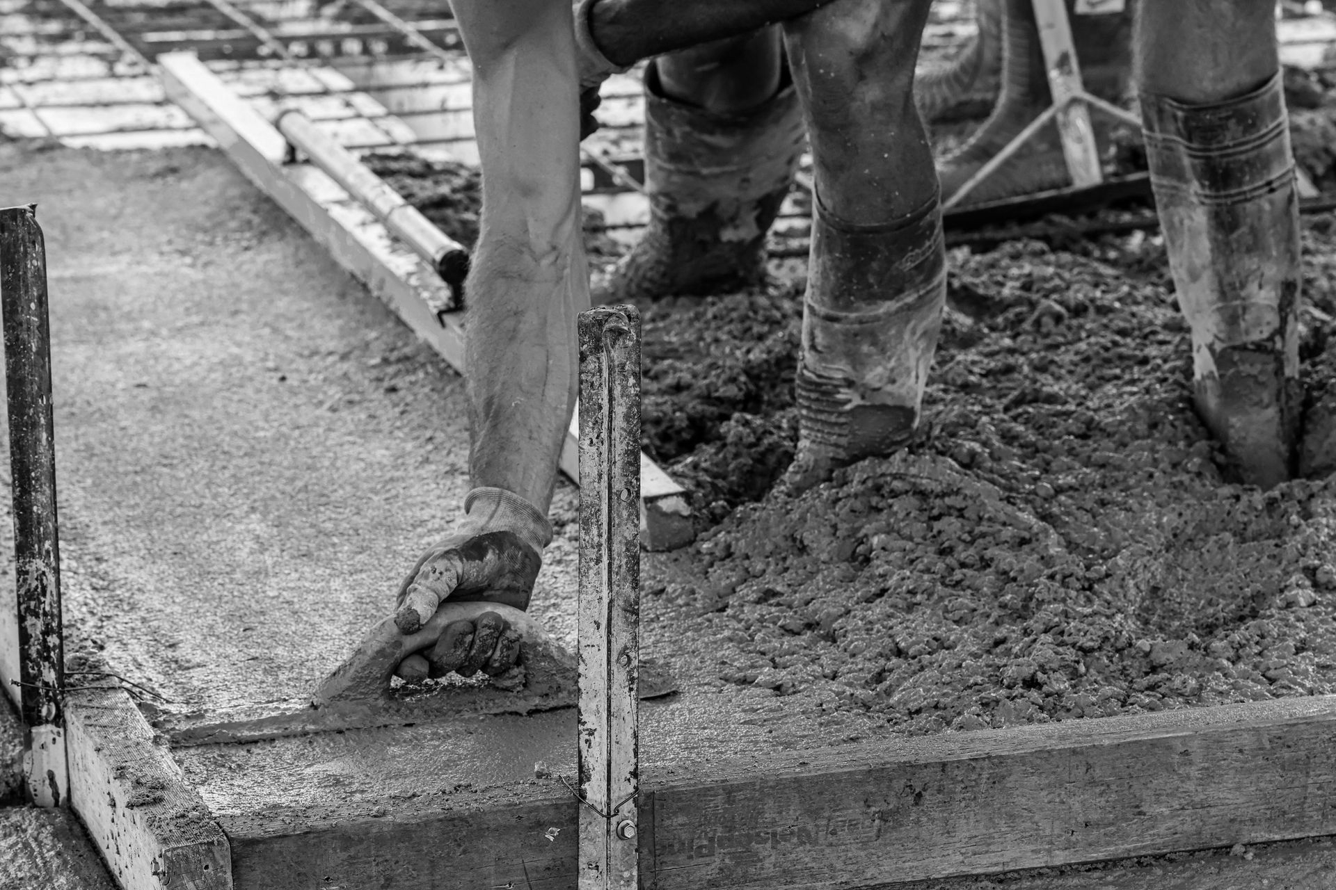 Construction Workers Spreading Wet Concrete — Complete Concreting Riverina In Ashmont, NSW