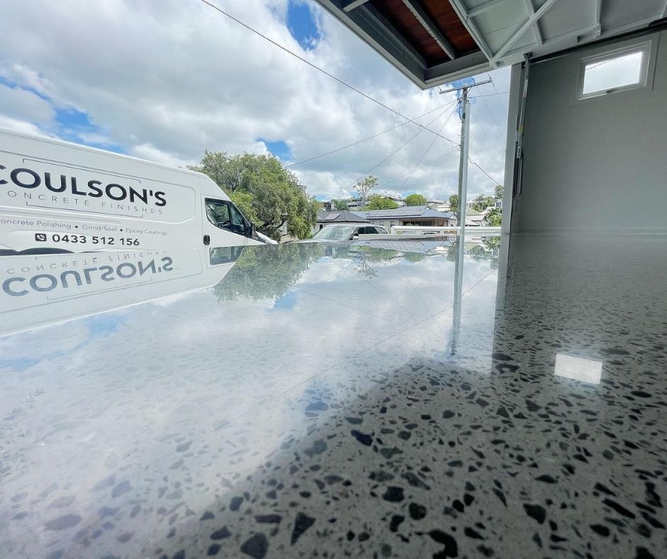 Polished concrete floor in a garage reflecting the sky.