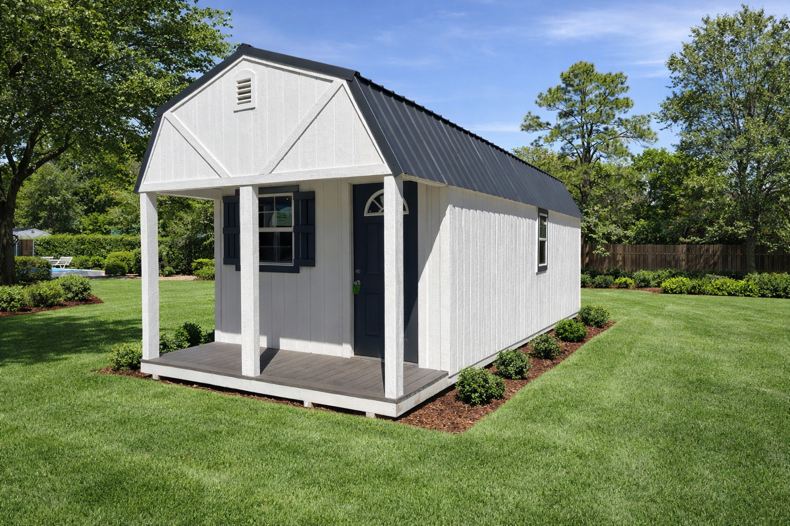 Light gray shed with teal doors and windows, set against trees.