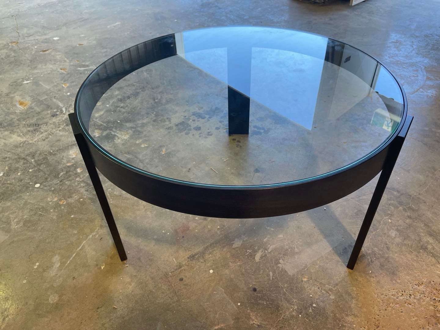 Round Coffee Table With a Glass Top and Black Metal Frame  — Norrland in Merewether, NSW