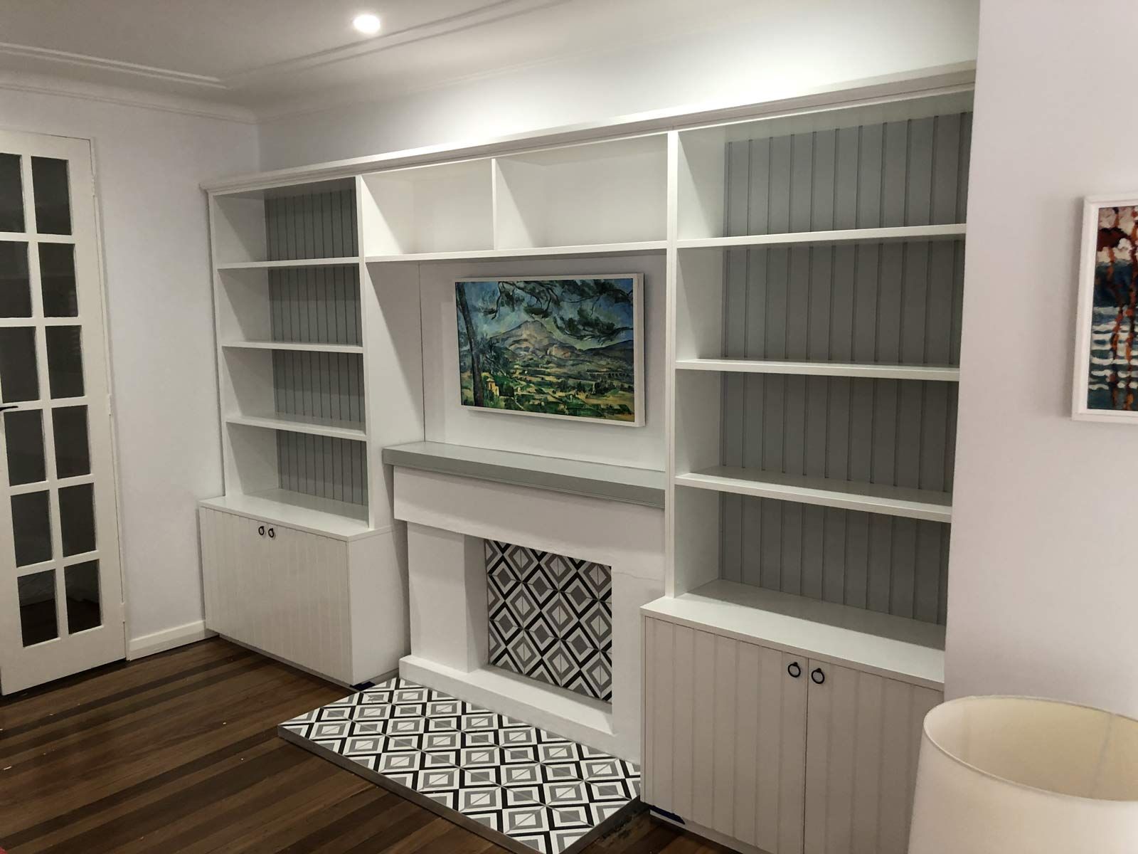 Built-in White Bookshelves With Cabinets Frame a Fireplace and Tv — Norrland in Warners Bay, NSW