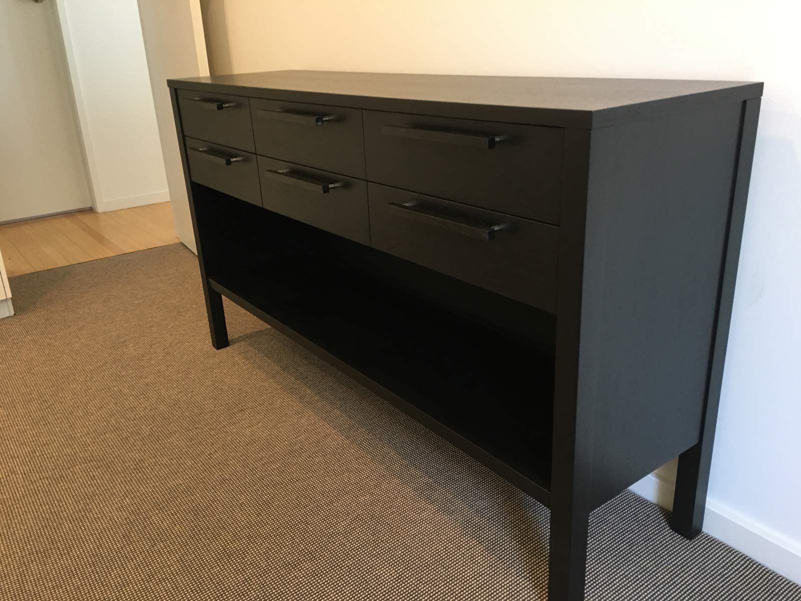 Black Dresser With Six Drawers, Open Shelf, and Black Handles, on Beige Carpet — Norrland in Warners Bay, NSW