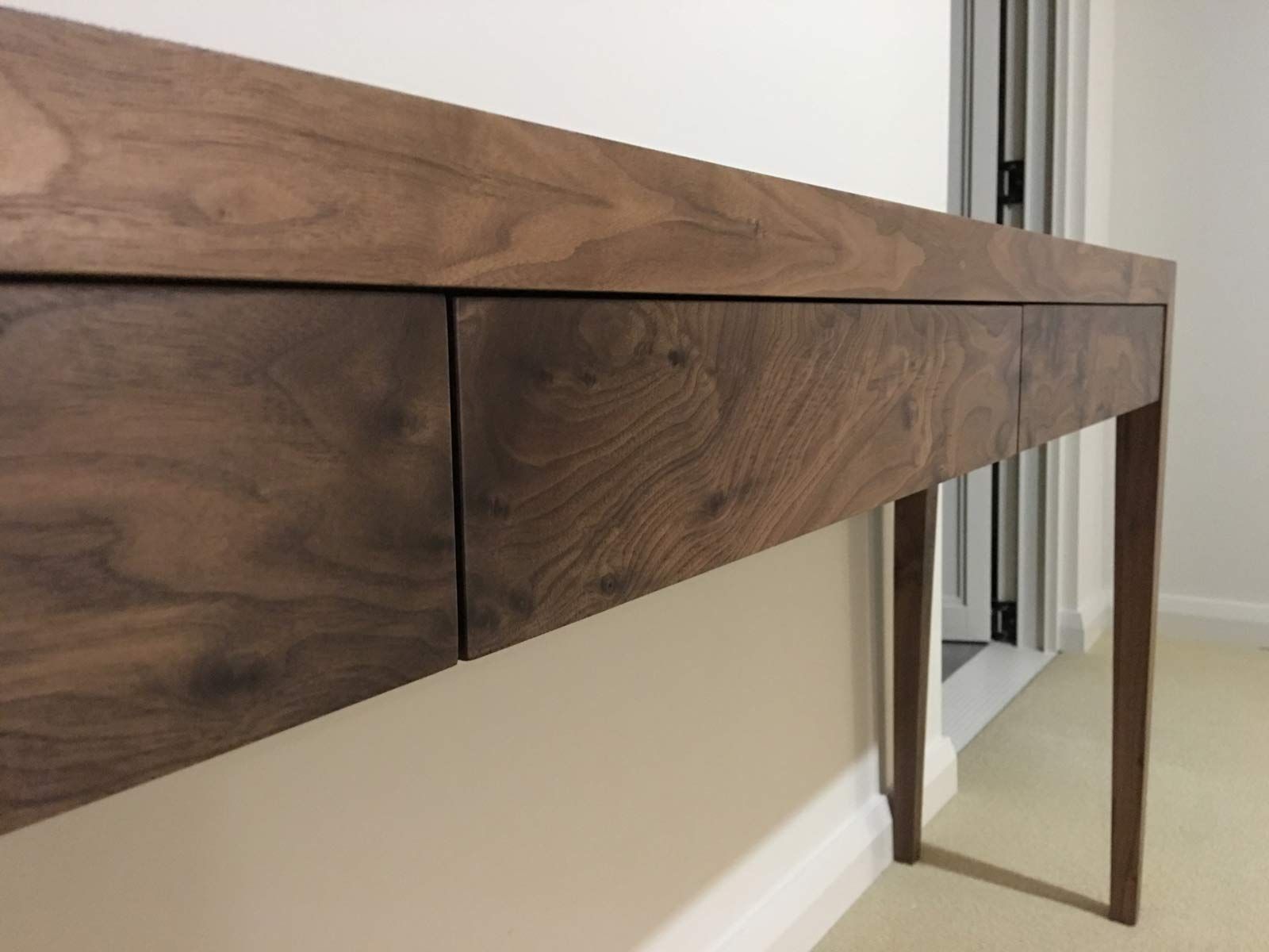 Wooden Desk With Drawers Against a Light-coloured Wall — Norrland in Warners Bay, NSW