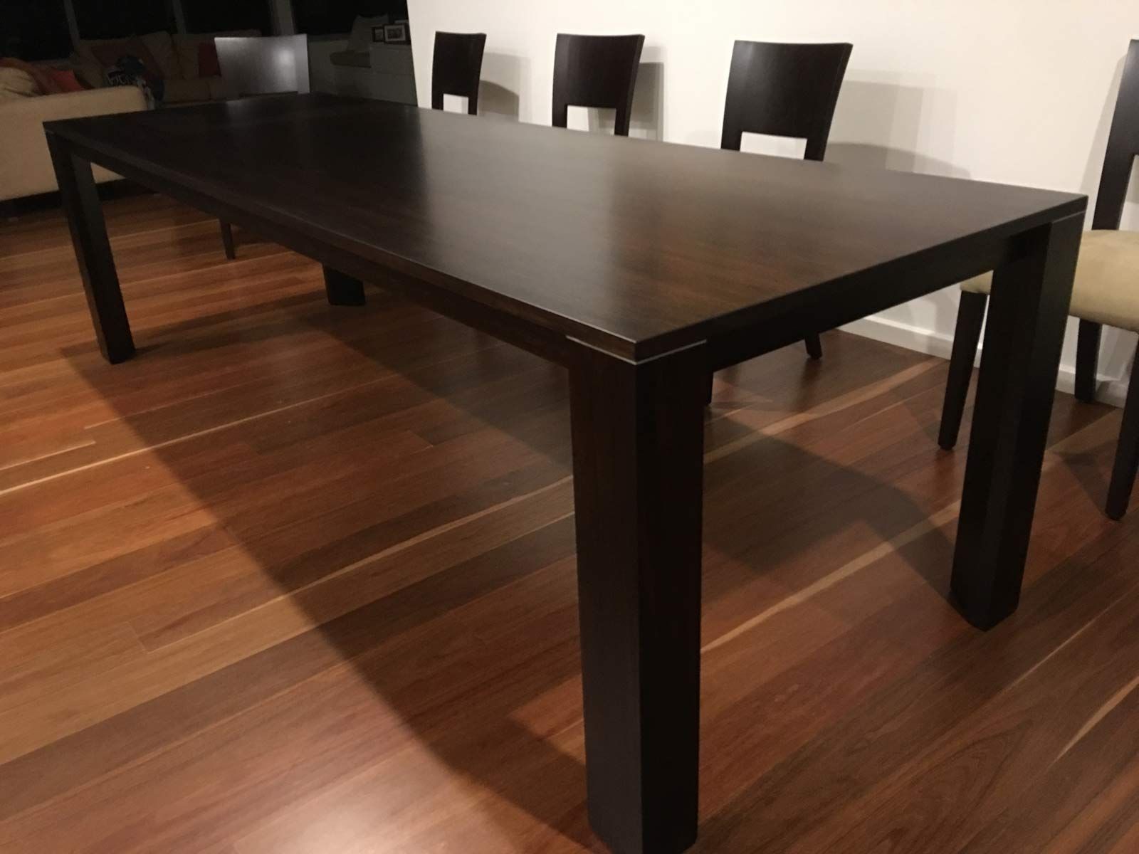 Dark Brown Rectangular Dining Table With Chairs on a Wooden Floor — Norrland in Warners Bay, NSW