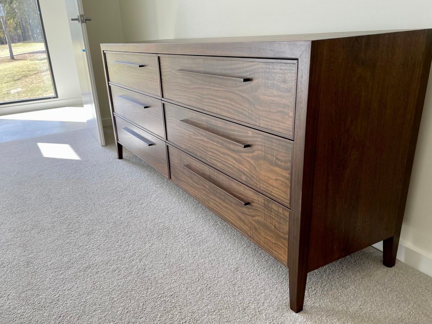 Wooden Dresser With Six Drawers, Resting on a Beige Carpet — Norrland in Warners Bay, NSW