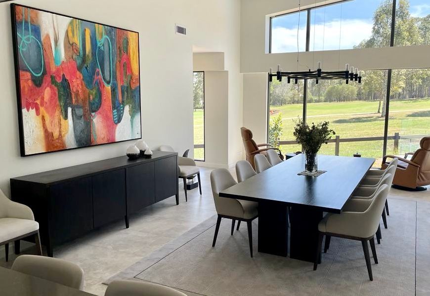 Modern Dining Room With a Long Table, Chairs, Art, and Large Windows With a View — Norrland in Warners Bay, NSW