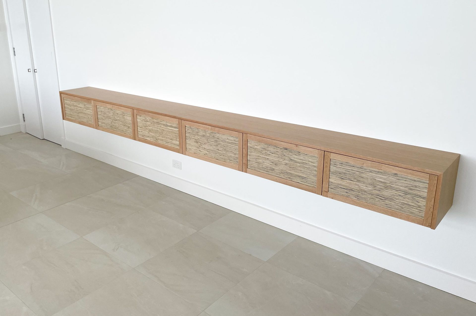 Floating Wooden Cabinet With Six Drawers Mounted on a White Wall in a Room — Norrland in Warners Bay, NSW
