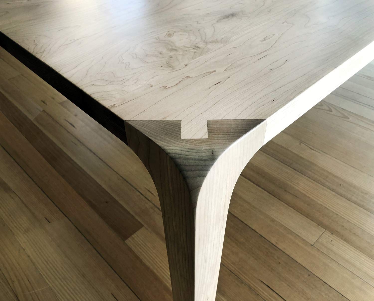 Close-up of a Wooden Table Corner With Curved Legs and a Unique Joinery Detail — Norrland in Warners Bay, NSW