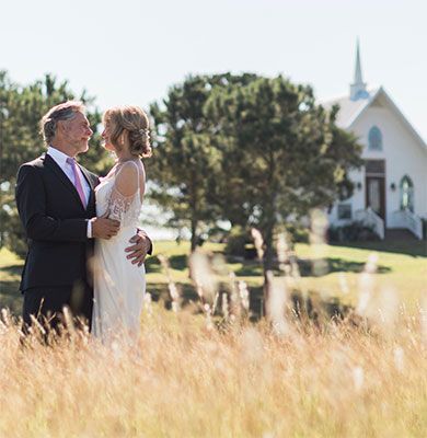 bride-and-groom-in-a-field