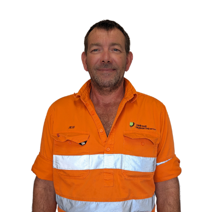 A man wearing an orange shirton it