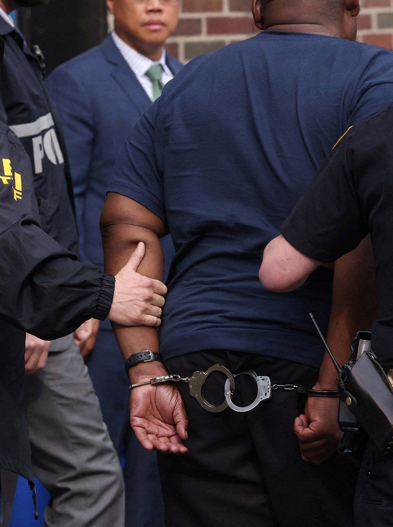 officer arresting young man