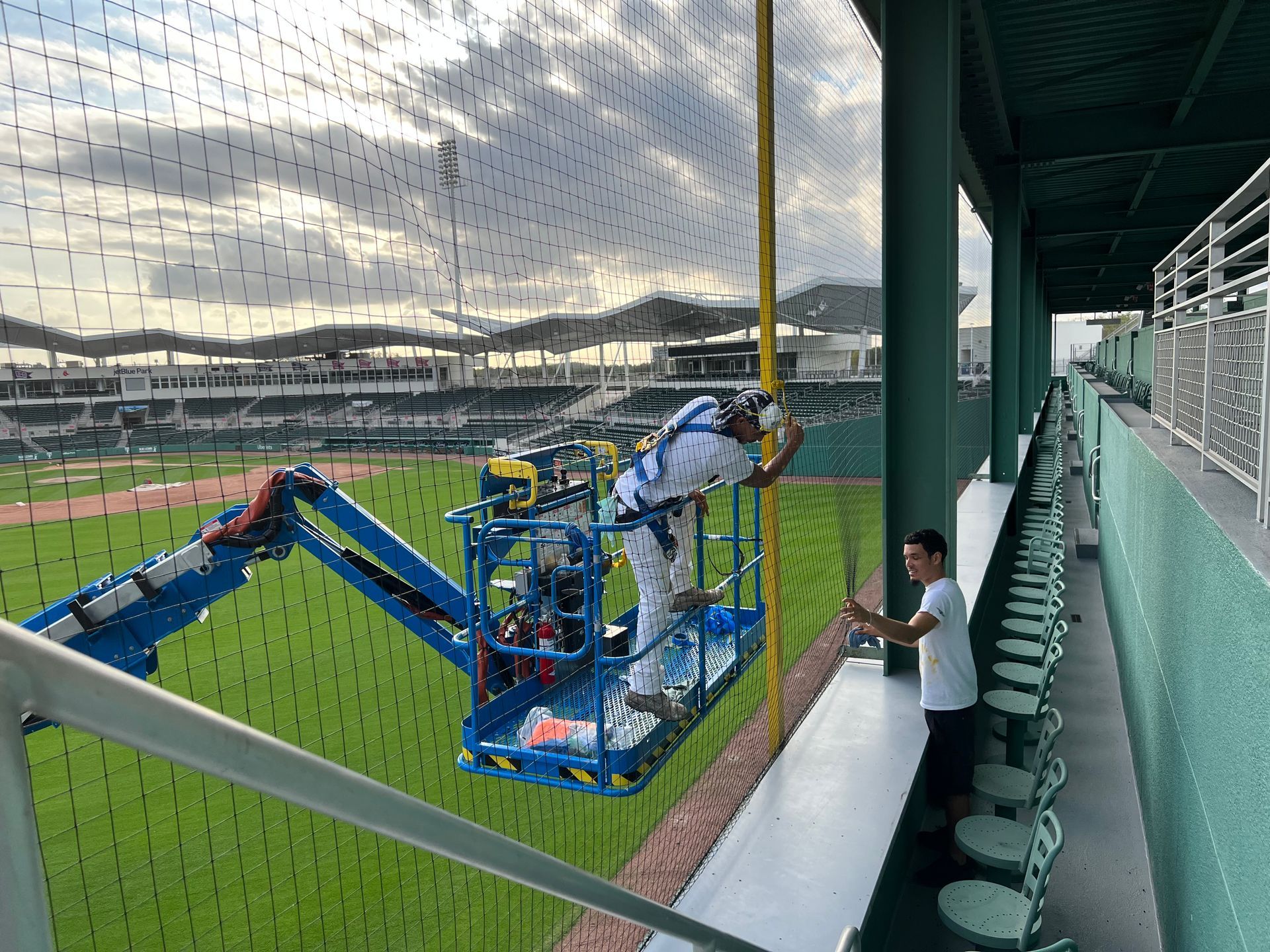 Commercial exterior painting project using lift equipment by Abuelo's Painting in Southwest Florida