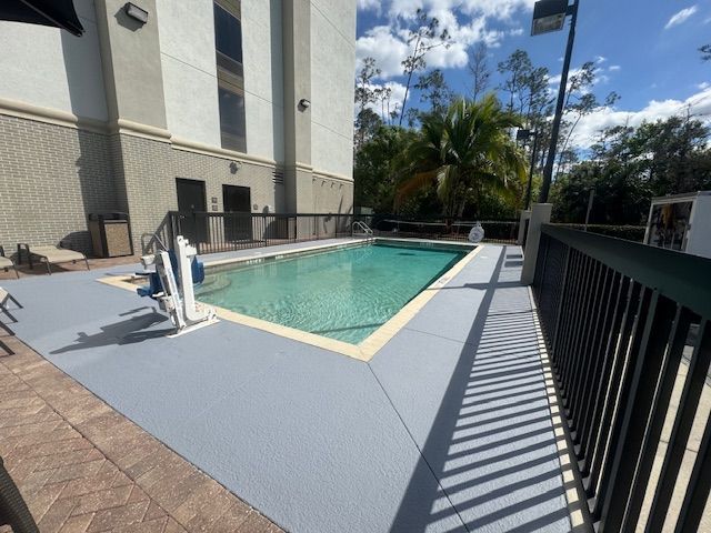 Hotel Pool deck painting and pressure washing project in Estero Florida by Abuelo's Painting 